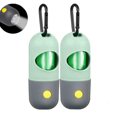 Dispensador del tenedor del bolso de la basura del perro del impulso del animal doméstico de la linterna de LED de la forma de la píldora